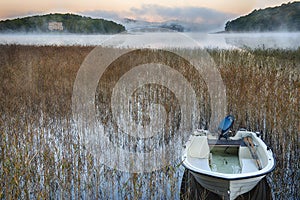 Rowboat in morning mist