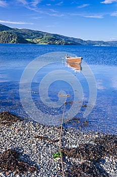 Rowboat in Norwegian fjord