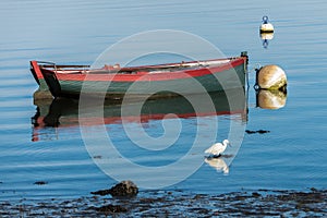 Rowboat, white boat and buoy in Brittany