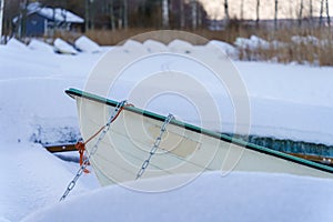 Rowboat in winter harbor photo