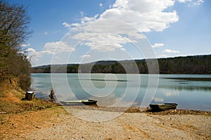 Rowboats on lake beach photo