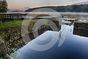 Rowboats in morning mist