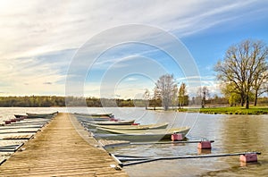 Rowboats tied to a wooden pier