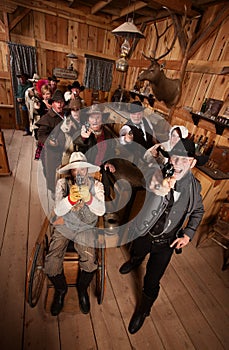 Rowdy Crowd with Guns in Saloon