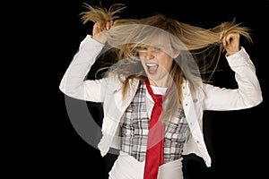 Rowdy and excited girl pulling her hair black background