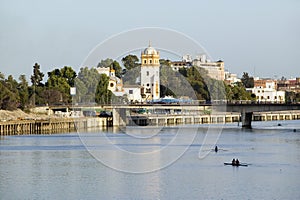 Rowers on Canal de Alfonso of Rio Guadalquivir River, Sevilla, Southern Spain photo