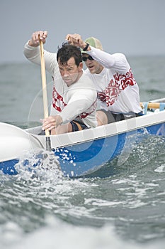 Rowers Paddling Outrigger Canoe