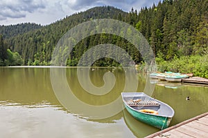 Rowing boat in the Lacu Rosu lake photo