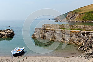 Rowing boat moored in tiny harbour