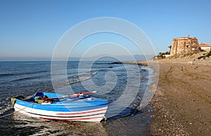 Rowing Boat in Sea at Sunrise in Spain