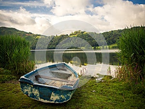A rowing boat on the shore of Grasmere photo