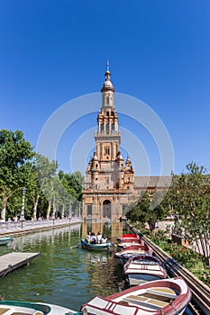 Rowing boats in front of the tower at Plaza Espana in Sevilla