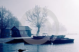 Rowing Boats on Llangorse lake on a cold winter`s morning.