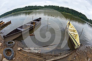 Rowing boats moored on a river bank