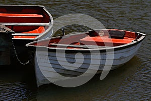 Rowing Boats Tied To Wooden Lake Pier