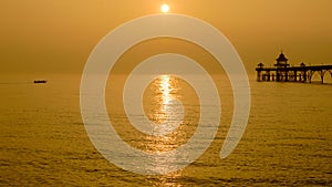 Rowing Crew And Pier at Sunset