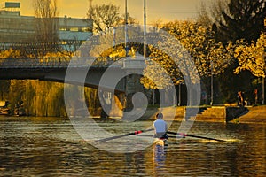 Rowing at sunset on the Bega River with Mary Maria / Traian bridge in Timisoara