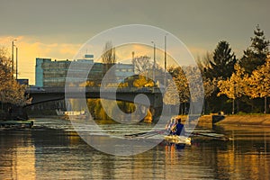 Rowing at sunset on the Bega River with Mary Maria / Traian bridge in Timisoara