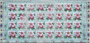 Rows of antique Nyonya Tiles with red flowers. Vintage wall tile in penang.