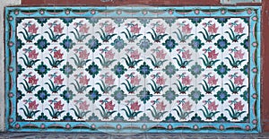 Rows of antique Nyonya Tiles with red tulips. Vintage wall tile in penang.