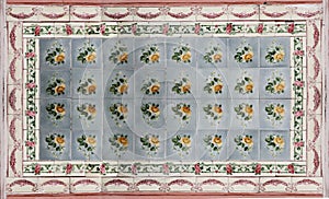 Rows of antique Nyonya Tiles with yellow flowers. Vintage wall tile in penang.