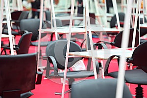 Rows of armchairs, tables and mirrors