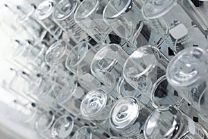 Rows of beaker on a drying rack.
