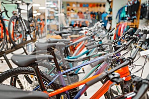 Rows of bicycles in sports shop, focus on seat