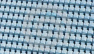 Rows of blue plastic stadium seats.