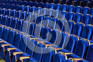 Rows of blue seats in the auditorium