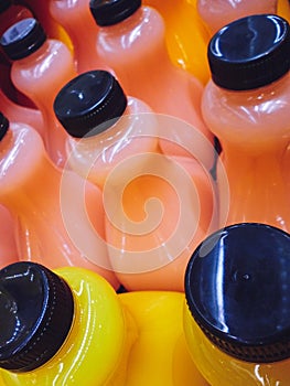 Rows of bottles of lemonade and orange juice