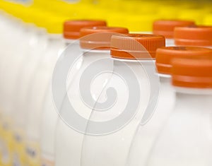 Rows with bottles of milk on the supermarket