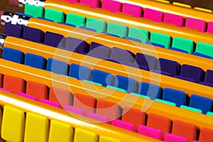 Rows of brightly colored pencil erasers lined up in an OCD order