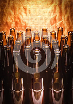 Rows of brown color empty bottles beer