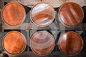 Rows of brown wooden alcohol barrels