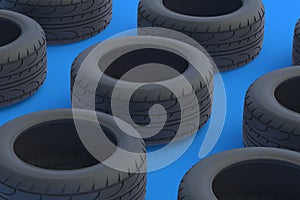 Rows of car tyres on blue background. Automotive parts
