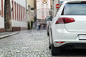 Rows of cars parked on the roadside in residential district