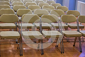 Rows of chairs in auditorium