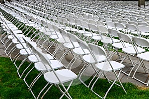 Rows of chairs form a beautiful pattern on the grass land