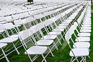 Rows of chairs form a beautiful pattern on the grass land