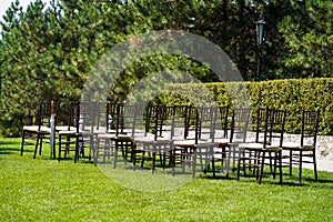 Rows of chairs for guests at an open-air wedding ceremony