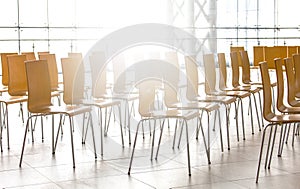Rows of chairs meeting background on sunlight