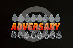 Rows of chess pawns with text adversary between the rows, a concept of business