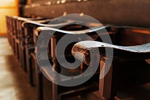 Rows of Church benches with sunlight close-up