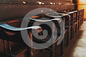 Rows of Church benches with sunlight close-up