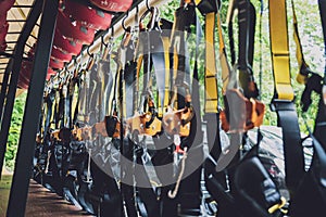 Rows of climbing safety ropes and carabiners and helmets