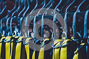 Rows of climbing safety ropes and carabiners and helmets