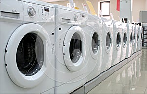 Rows of clothes washers in a store