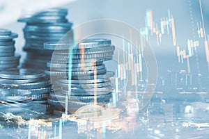 Rows of coin and graph of stock market trade