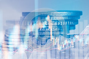 Rows of coin and graph of stock market trade indicator financial